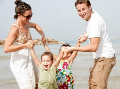 Family playing on the beach