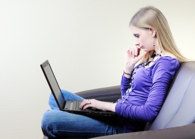 Girl With Laptop At Home
