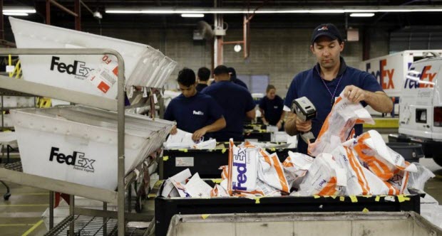 Package handlers at FedEx