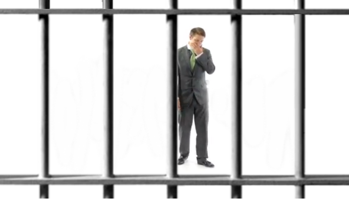 Sad Businessman in prison